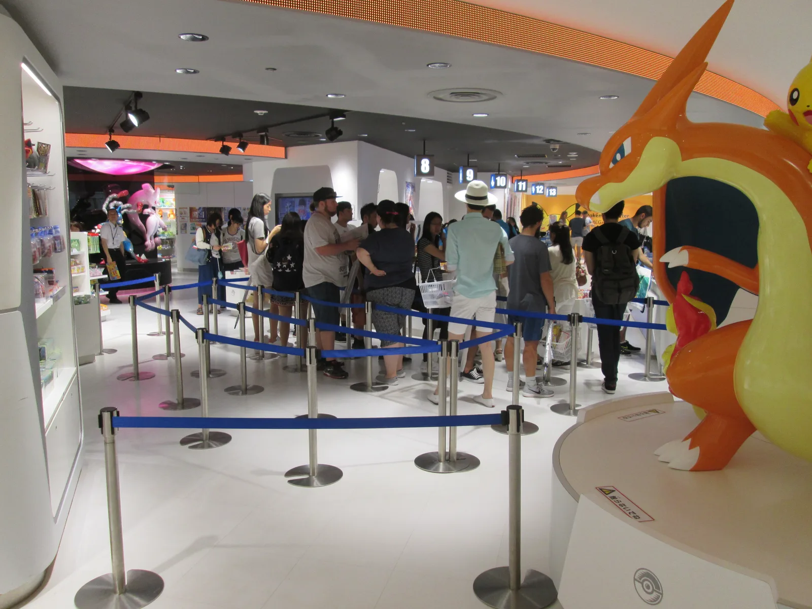 Shoppers queue outside the Mega Tokyo Pokémon Center store, one of the flagship shops selling official Pokémon TCG product in Japan.