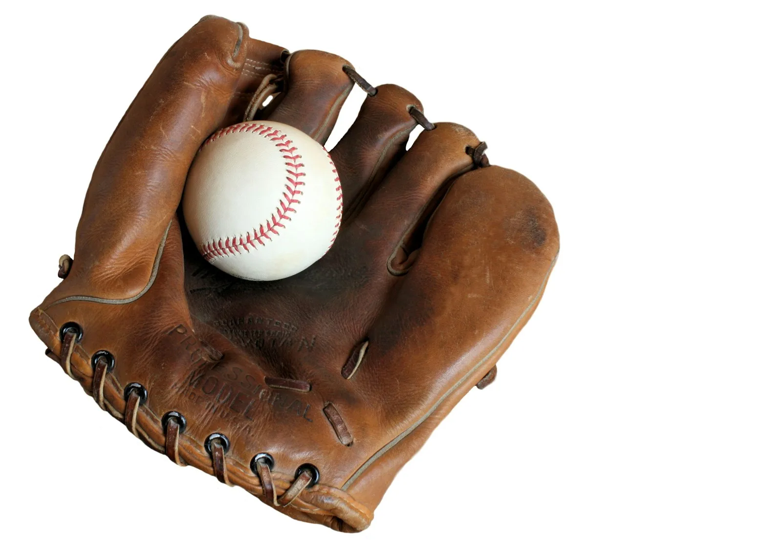 A worn brown leather baseball glove cradling a white baseball with red stitching, on a white background.