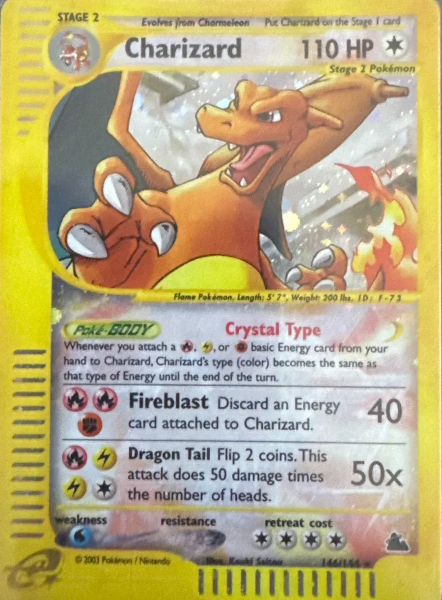 A holofoil Charizard trading card photographed close up, its foil surface catching the light.