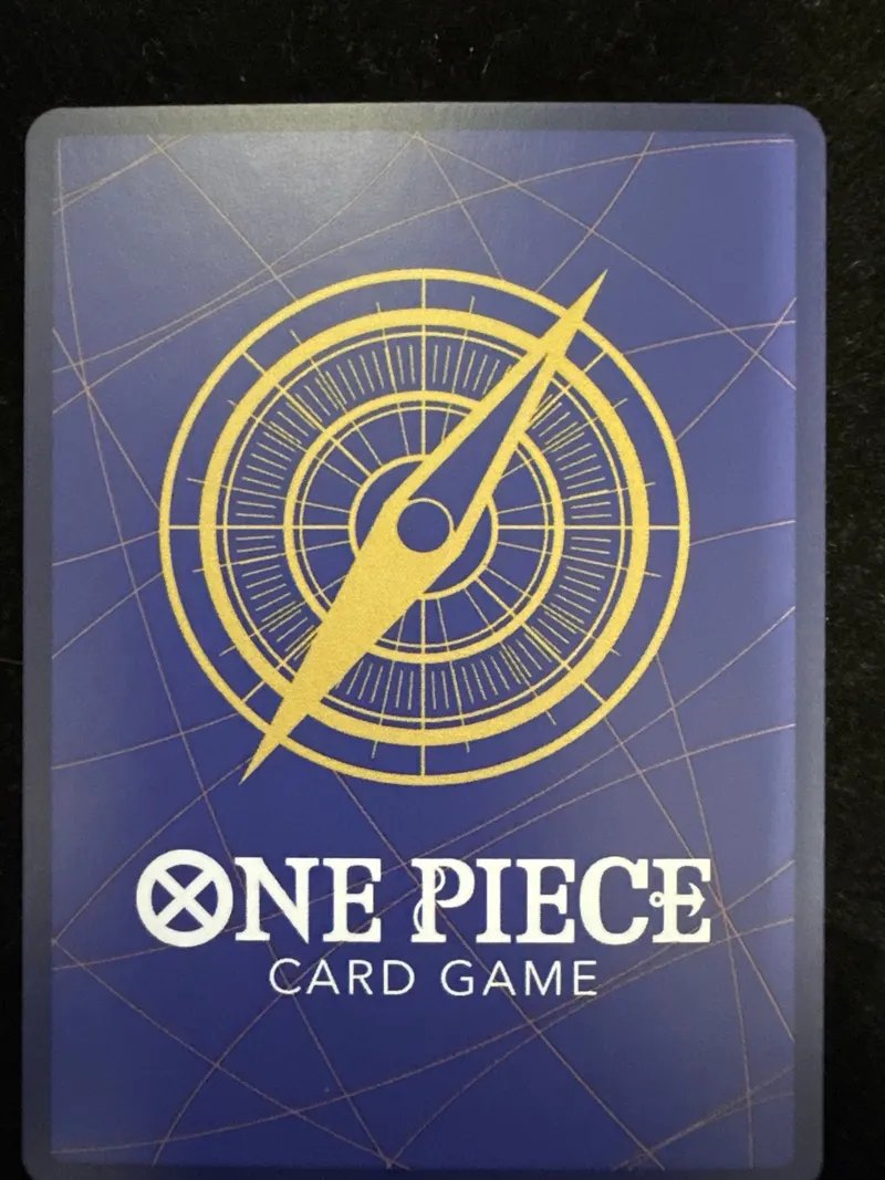 The same Nami OP01-016 card back after restoration at CardRevive