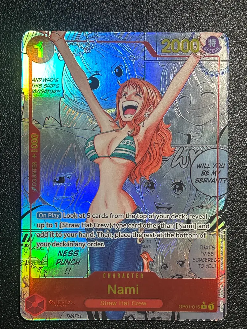 Nami OP01-016 manga rarity foil front before restoration at CardRevive, photographed under direct light with surface grime visible and rainbow foil flare across the card